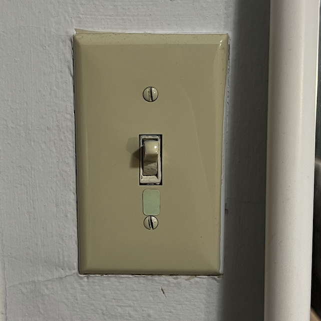The sound of a light switch turning on and off